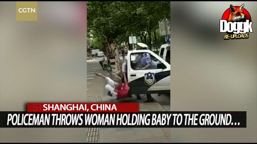 POLICEMAN THROWS WOMAN HOLDING A BABY TO THE GROUND... (SHANGHAI, CHINA)