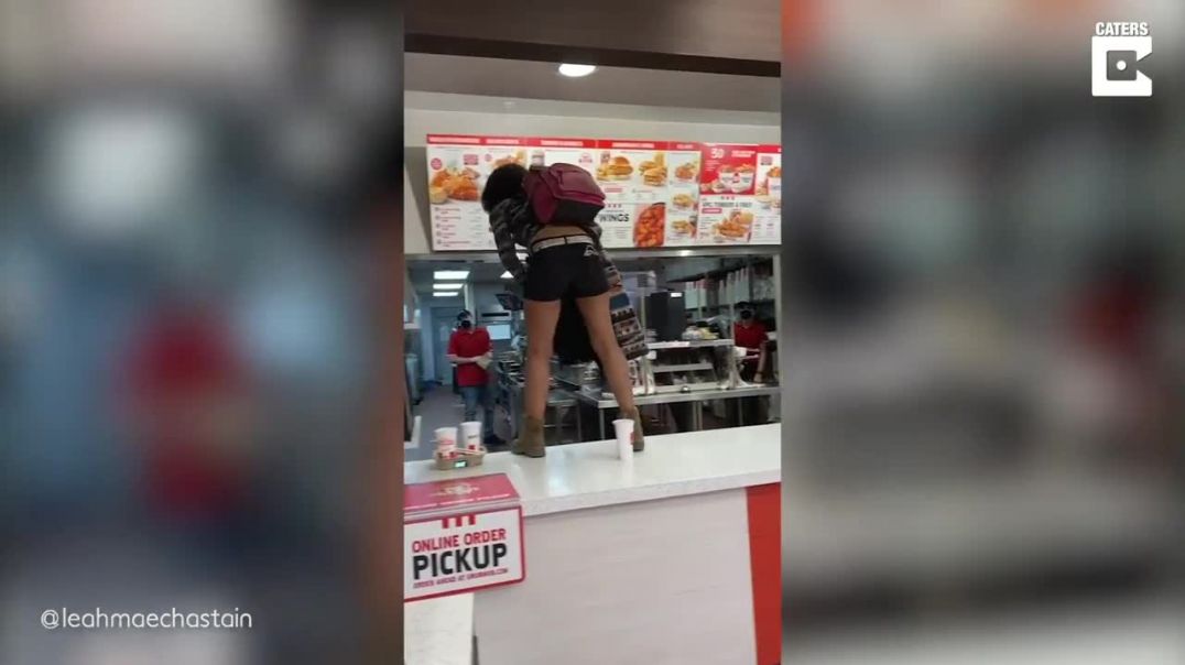 Angry Woman Kicks Off In KFC