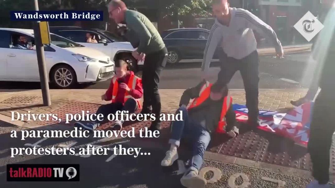 Insolent Britain activists pulled off the road by drivers, police and a paramedic