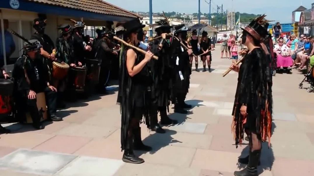 Beltane Border Morris dancing Huntress, Teignmouth Sea Front, Devon, UK