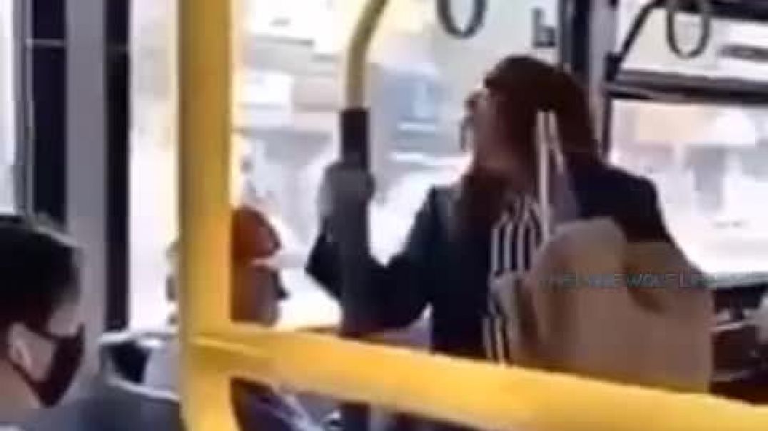 Woman spits in man's face on bus