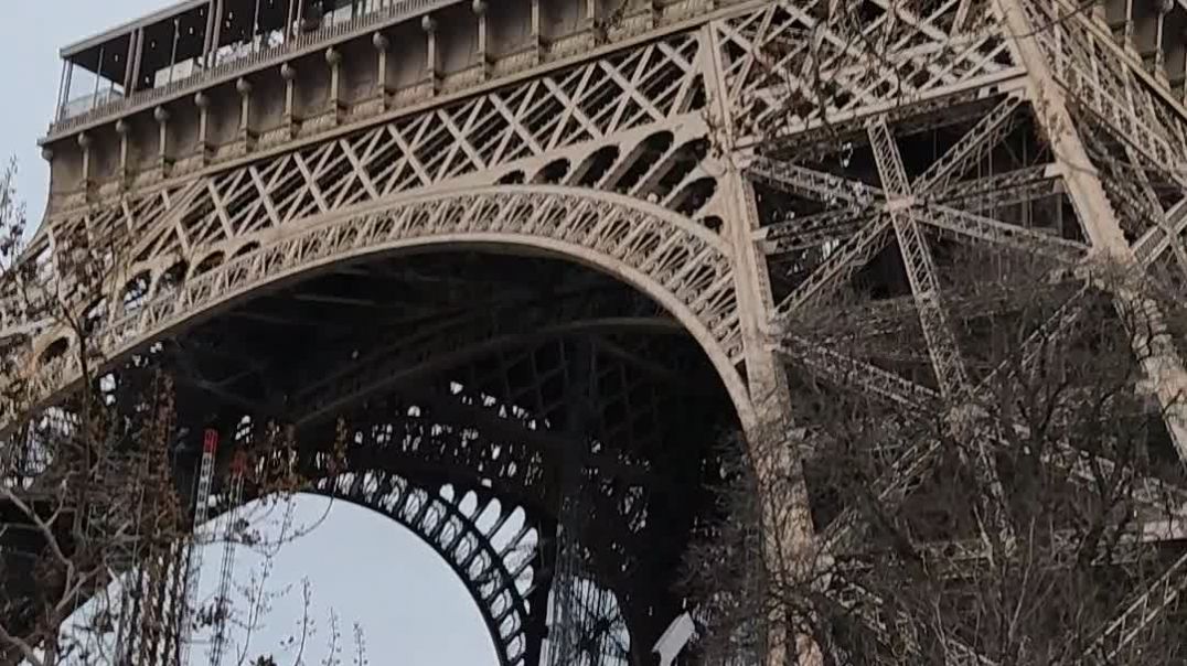 Bumkerised Eiffel Tower with wall glasses of peace.