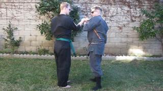 Filipino martial arts/Japanese Karate/Budo crossover. Defense against a stick with an injured arm.