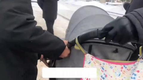 Infant terrorist detained in his stroller.
