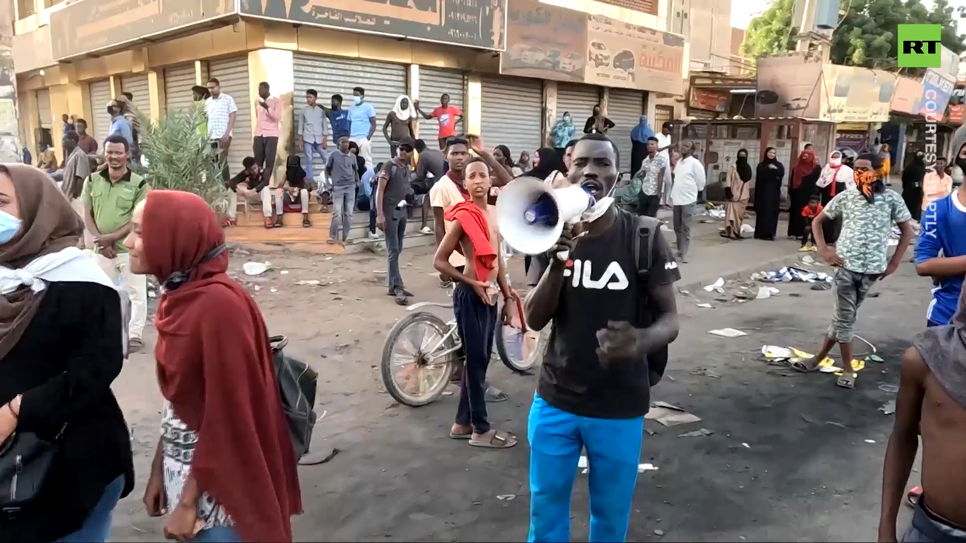 Burning tires & gas grenades fill Khartoum streets at anti-coup protest