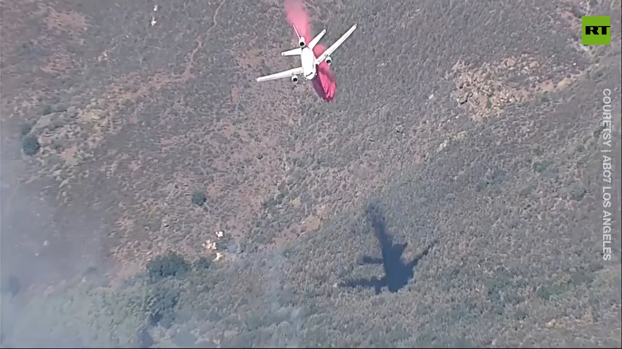 Fire crew tackles brush fire from the air