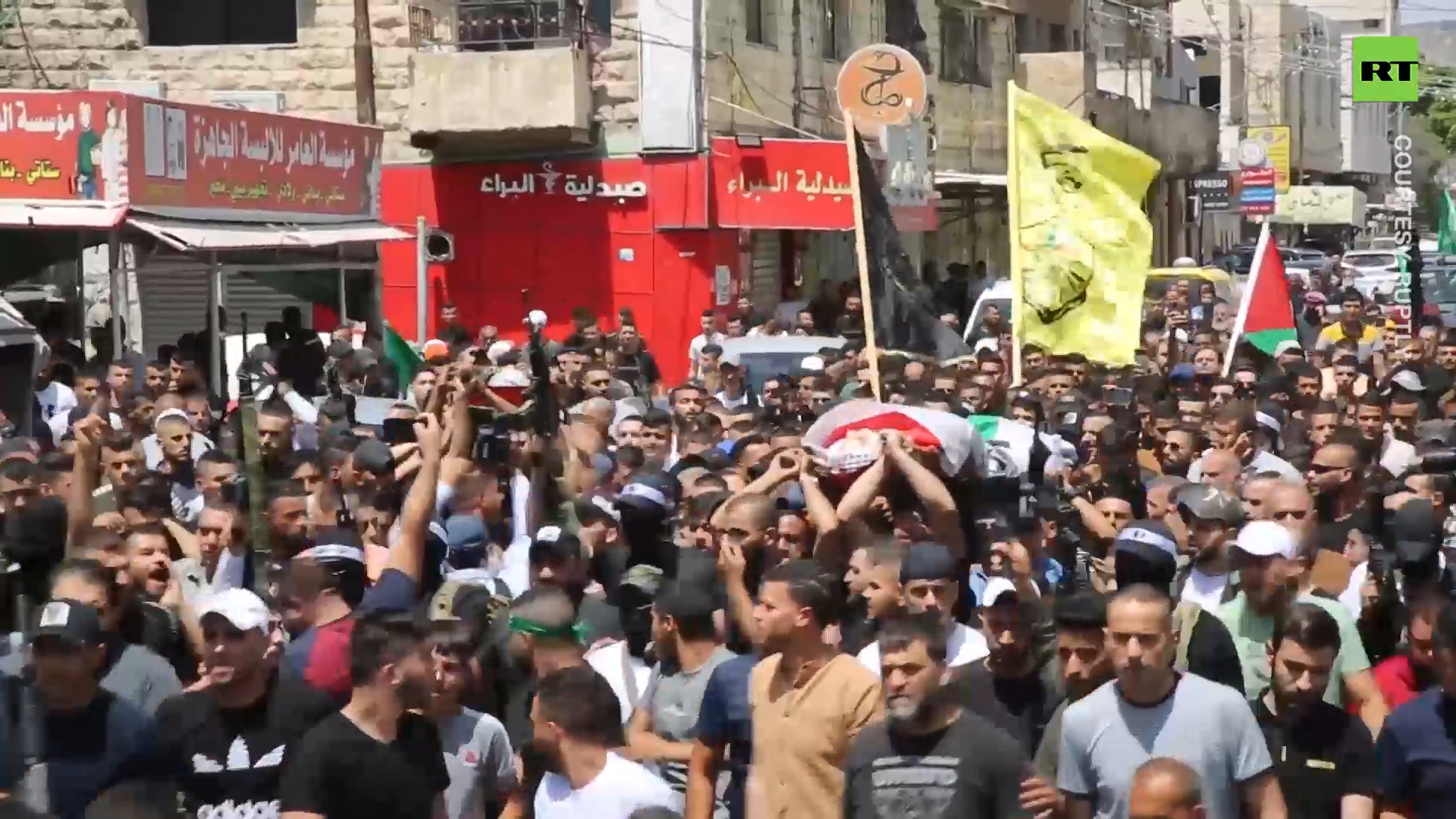 Gunfire rings out at funeral procession for Palestinians killed by IDF