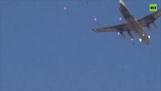 Syrian and Russian paratroopers fly in joint drill