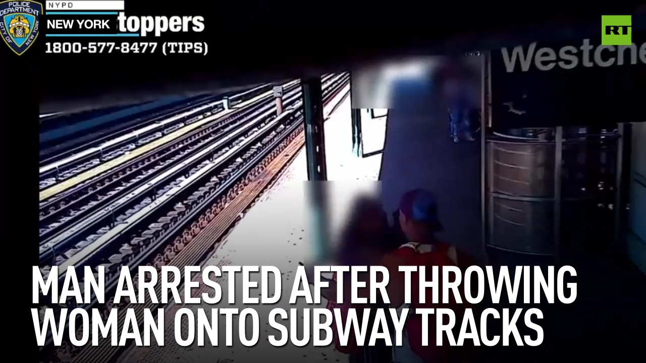 Man arrested after throwing woman onto subway tracks