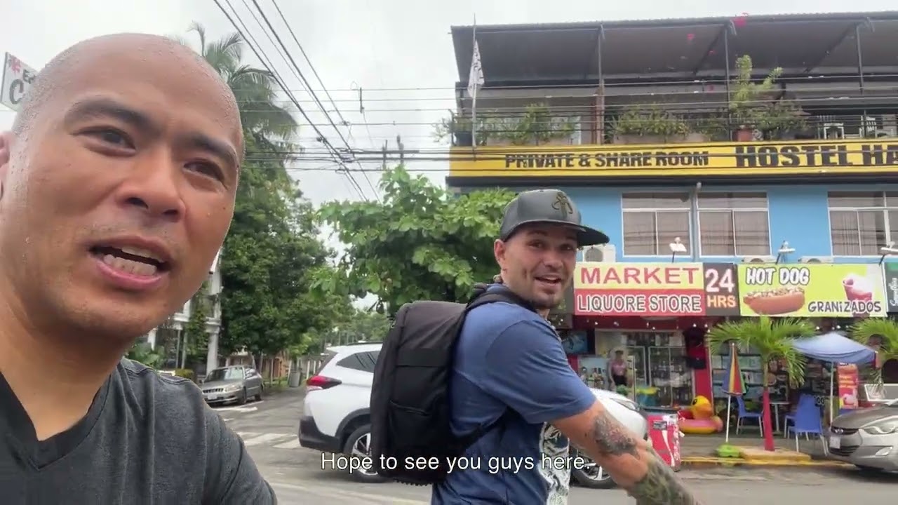 Biking the main street showing you some of the massage parlors & businesses jaco beach costa rica