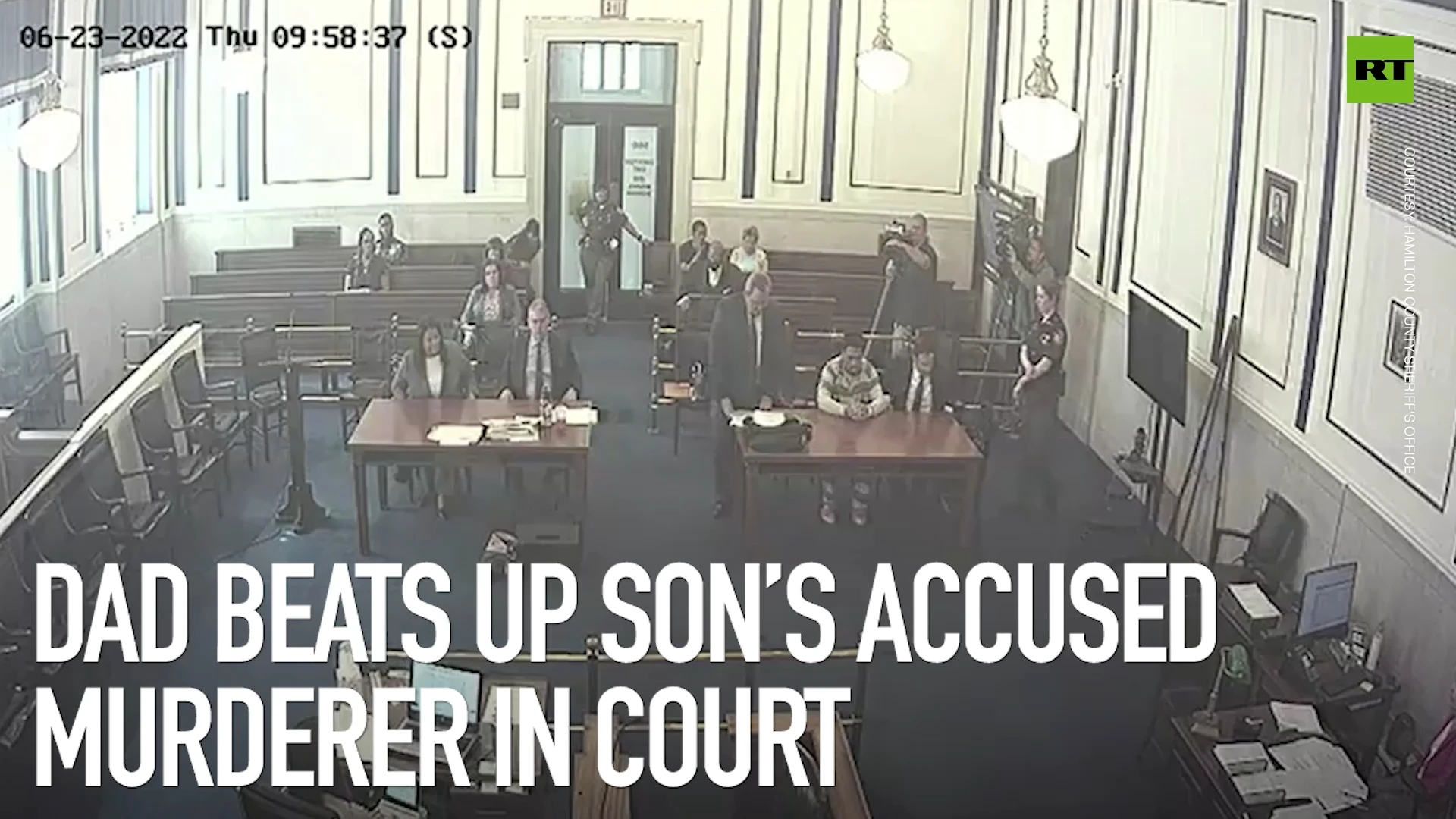 Dad beats up son’s suspected murderer in court