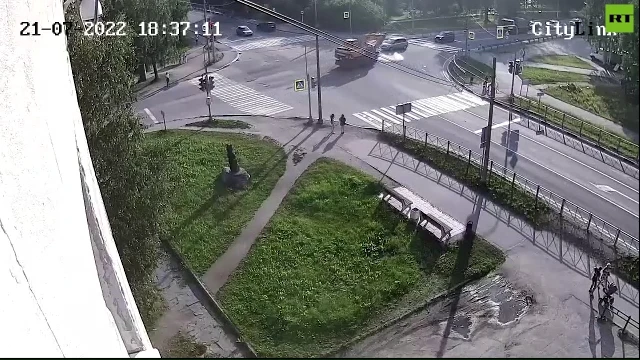 Excavator drives into police car flipping it over