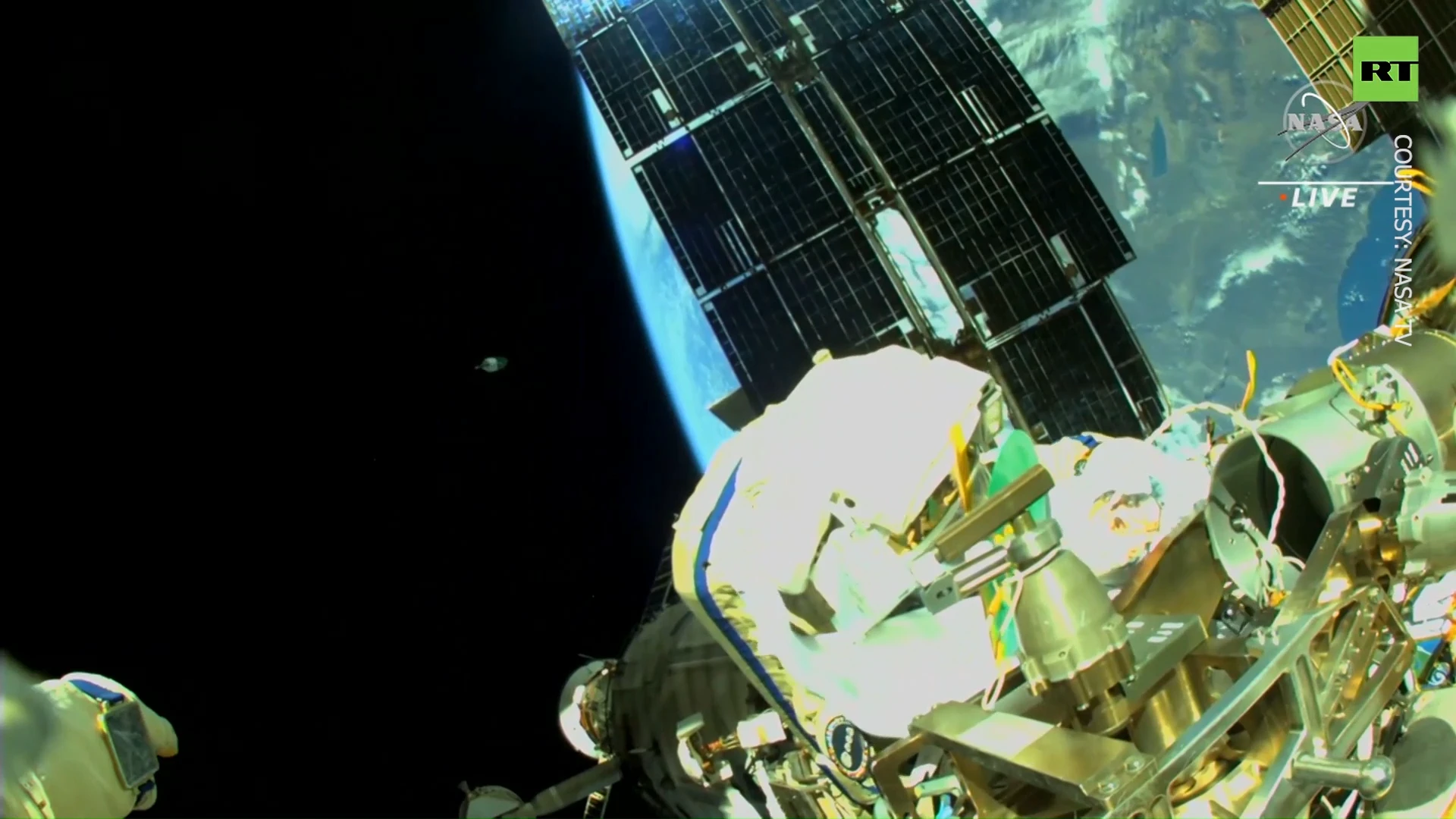 Russian & Italian astronomers work outside ISS to activate robotic arm