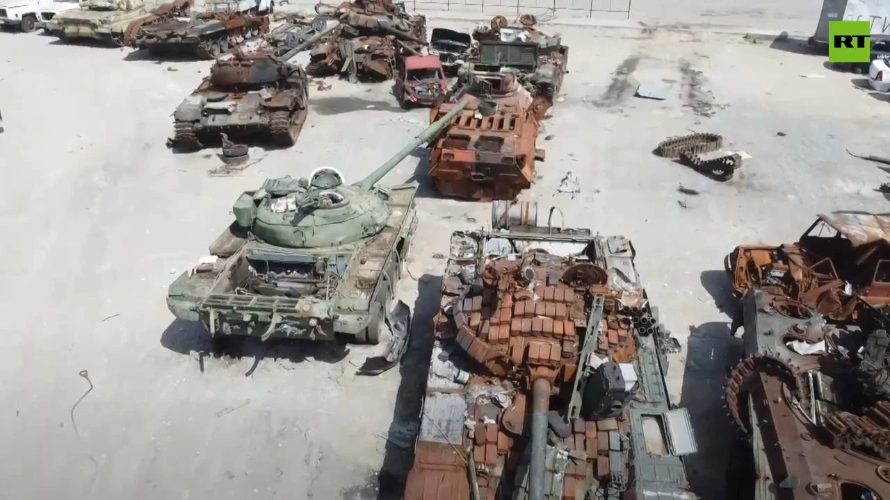 Mariupol car park turned into junkyard for tanks