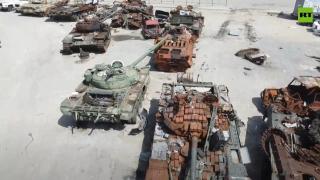 Mariupol car park turned into junkyard for tanks