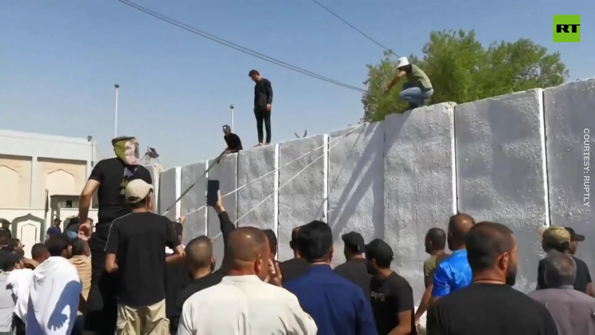 Al-Sadr supporters tear down concrete barriers while storming Iraq’s presidential palace