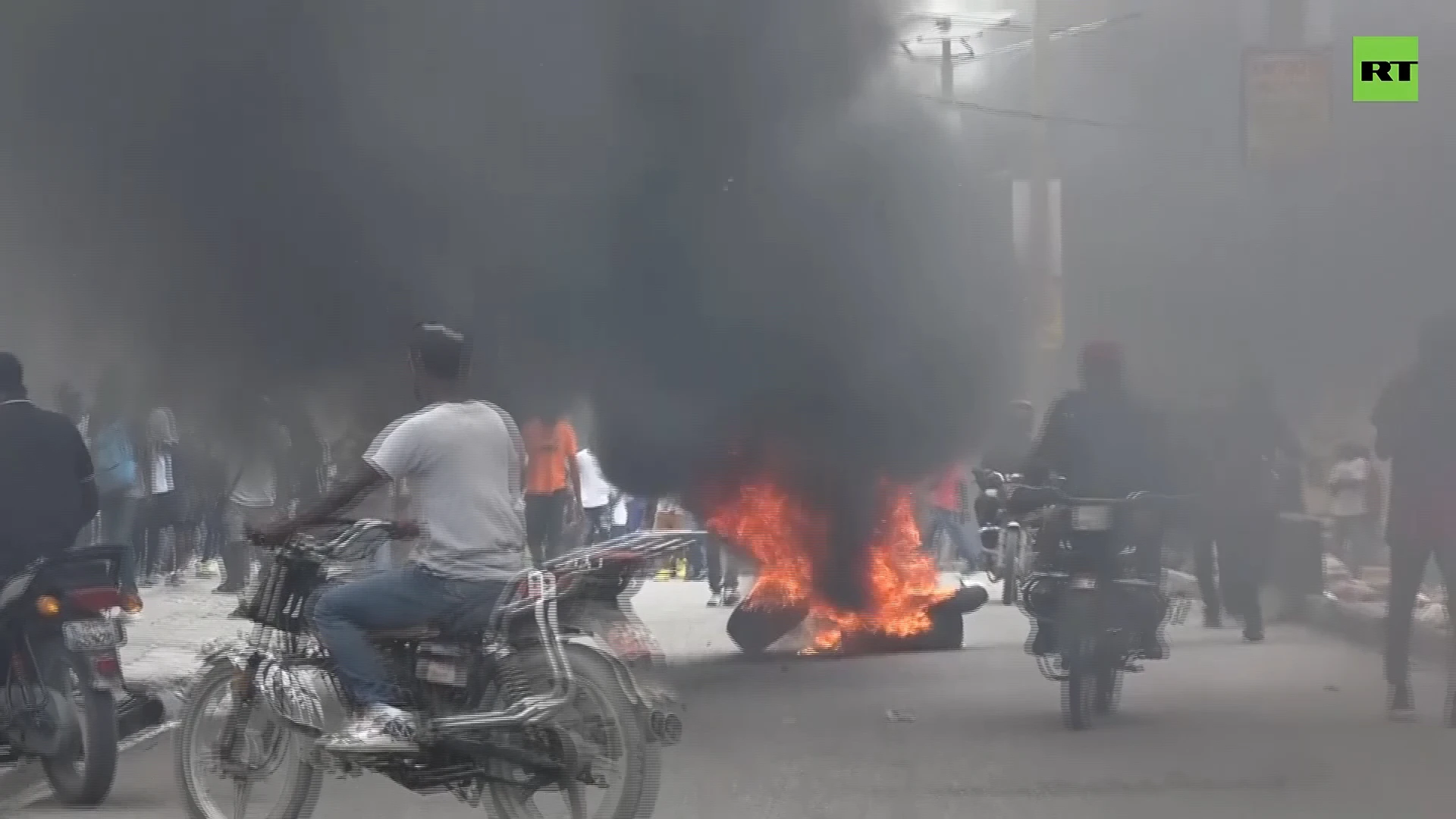 Hurling rocks & burning tires: Protests erupt over rising costs & insecurity in Haiti