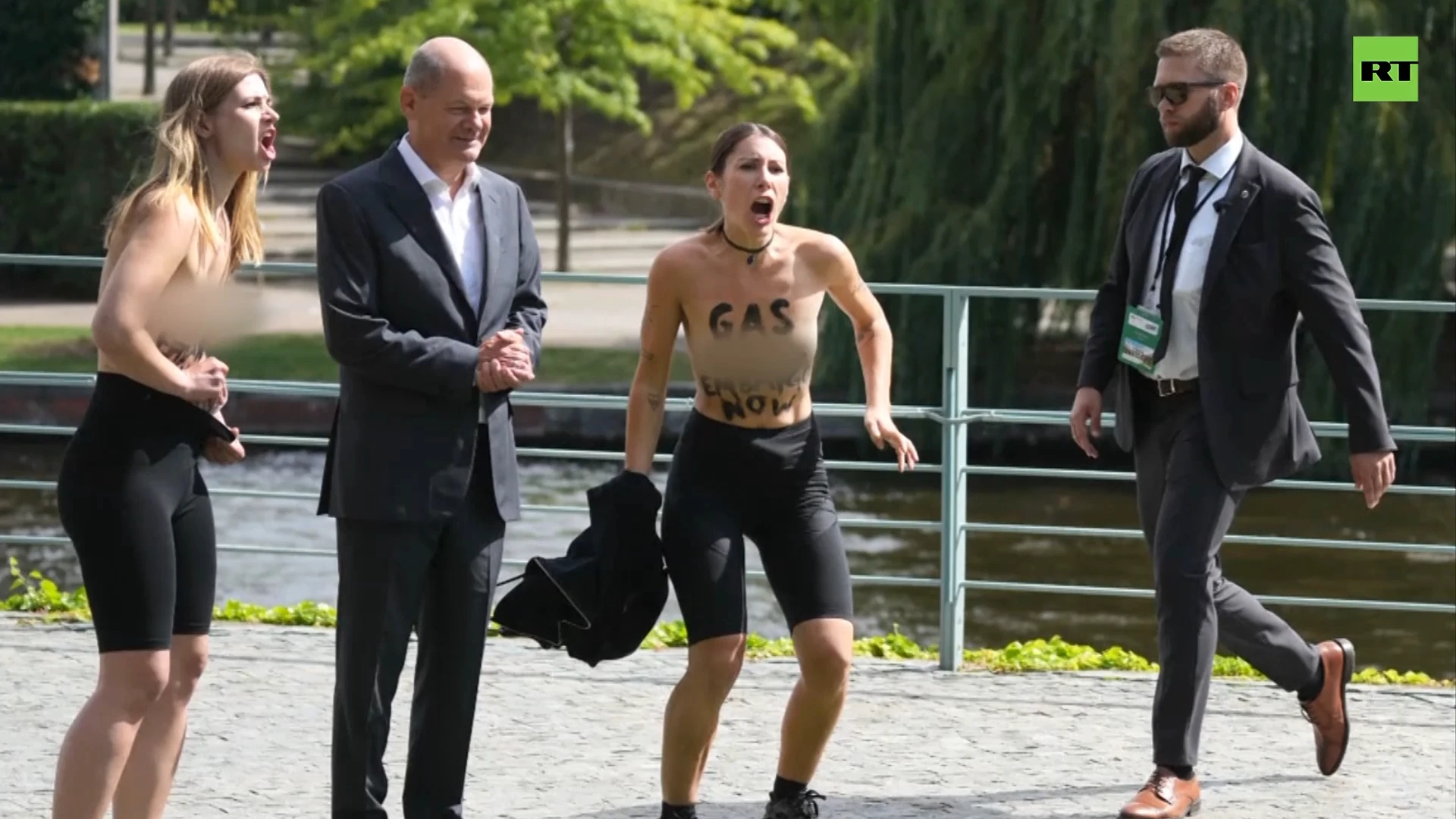 Topless activists storm Scholz event