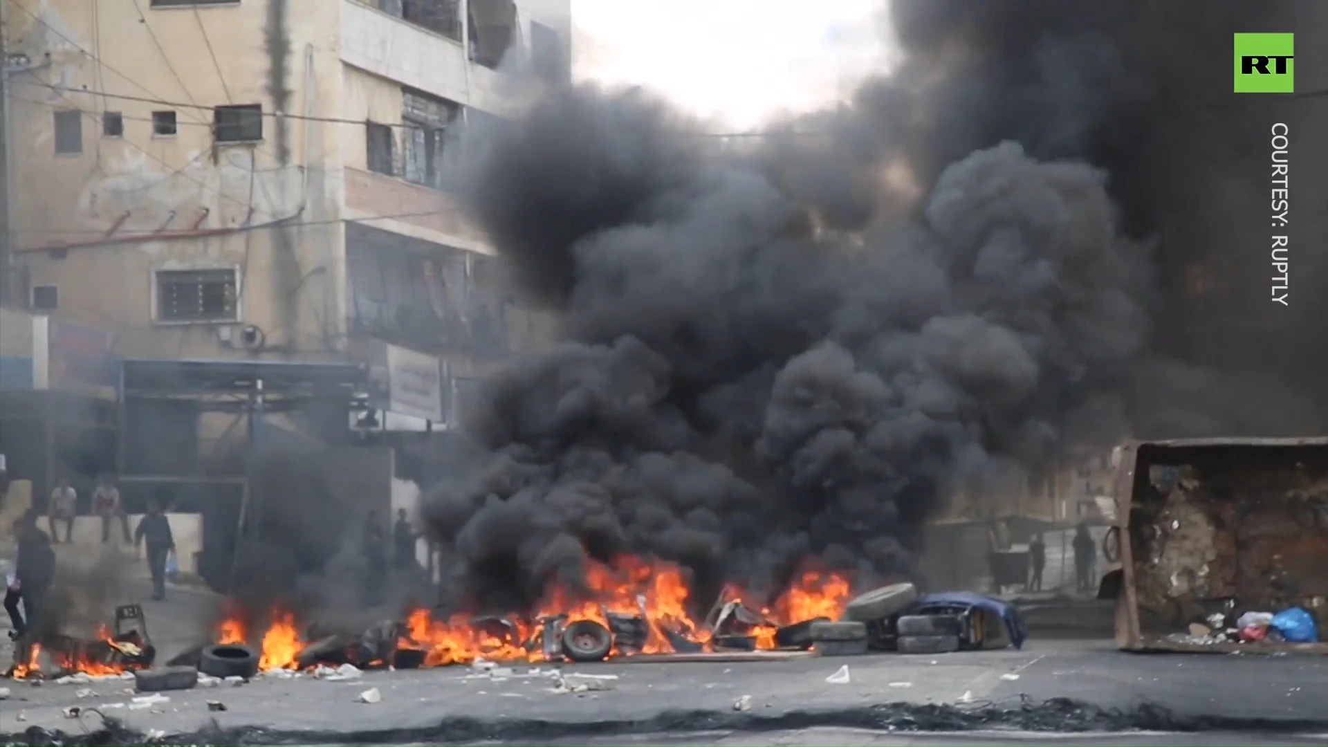 Clashes erupt between Palestinian forces and protesters in the West Bank