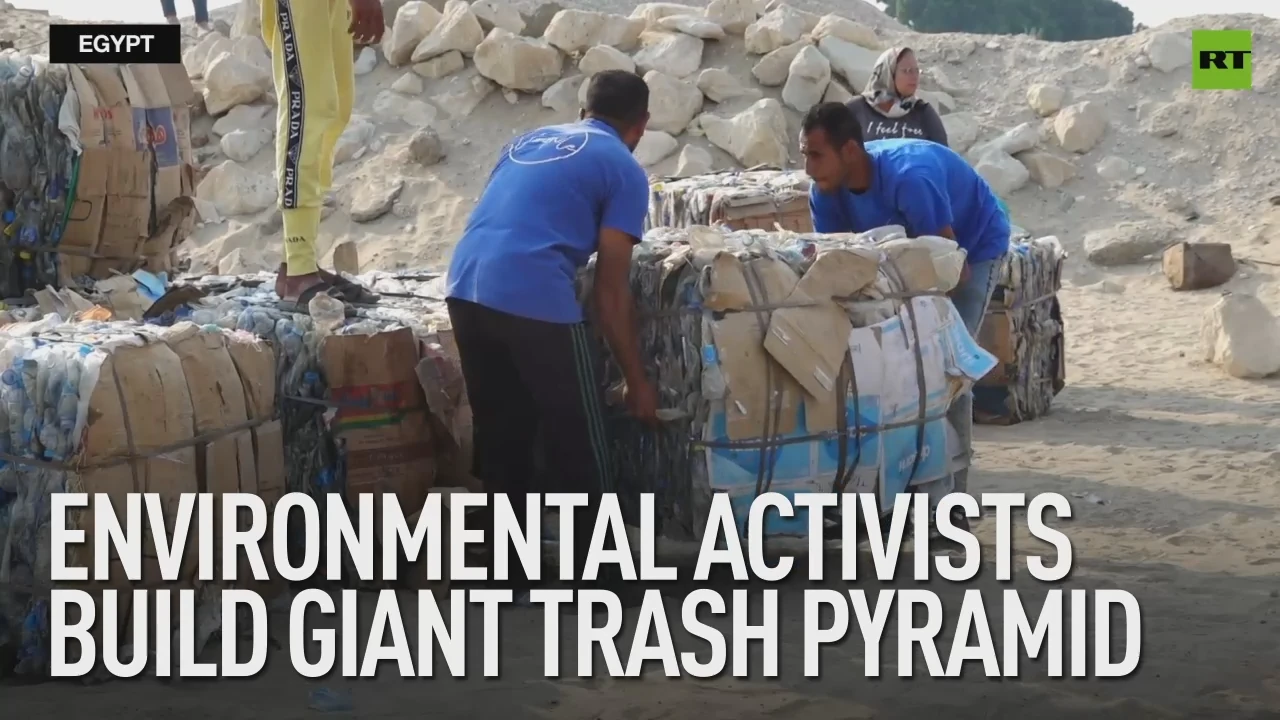 Environmental activists build giant trash pyramid