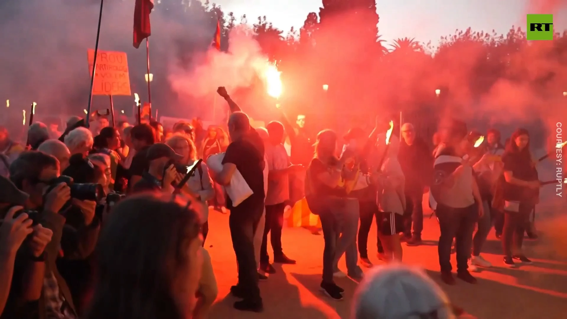 Demonstrators light up flares and torches on Catalan independence referendum anniversary