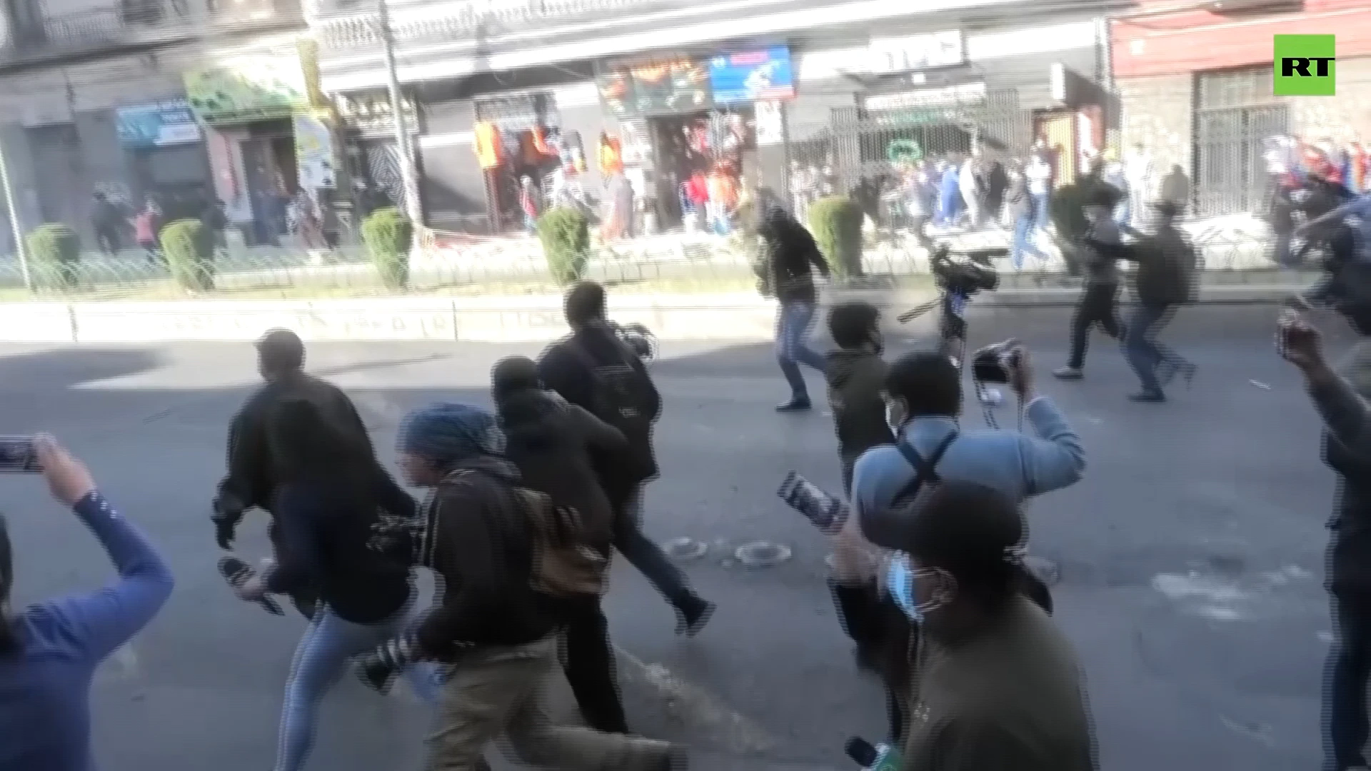 Protesters throw firecrackers at police during rally called by opposition