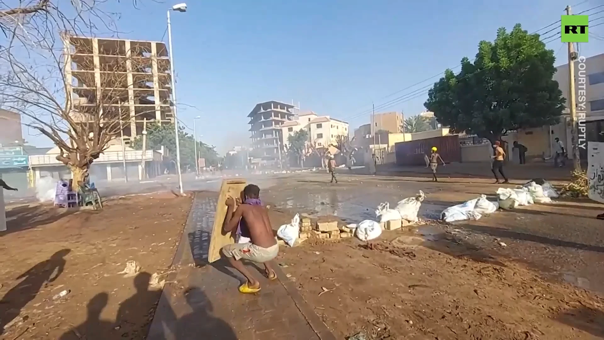 Clashes erupt as thousands of Sudanese protest military coup