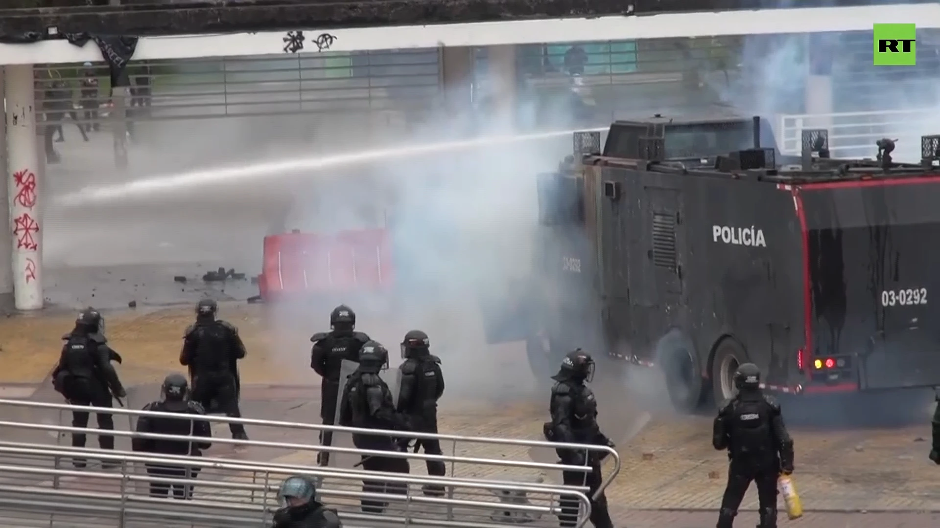 Stones, tear gas and water cannons: Protesters clash with cops in Bogota