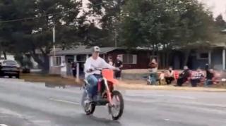 Man On Dirt Bike Laps Cop And Loses Him As Onlookers Cheer