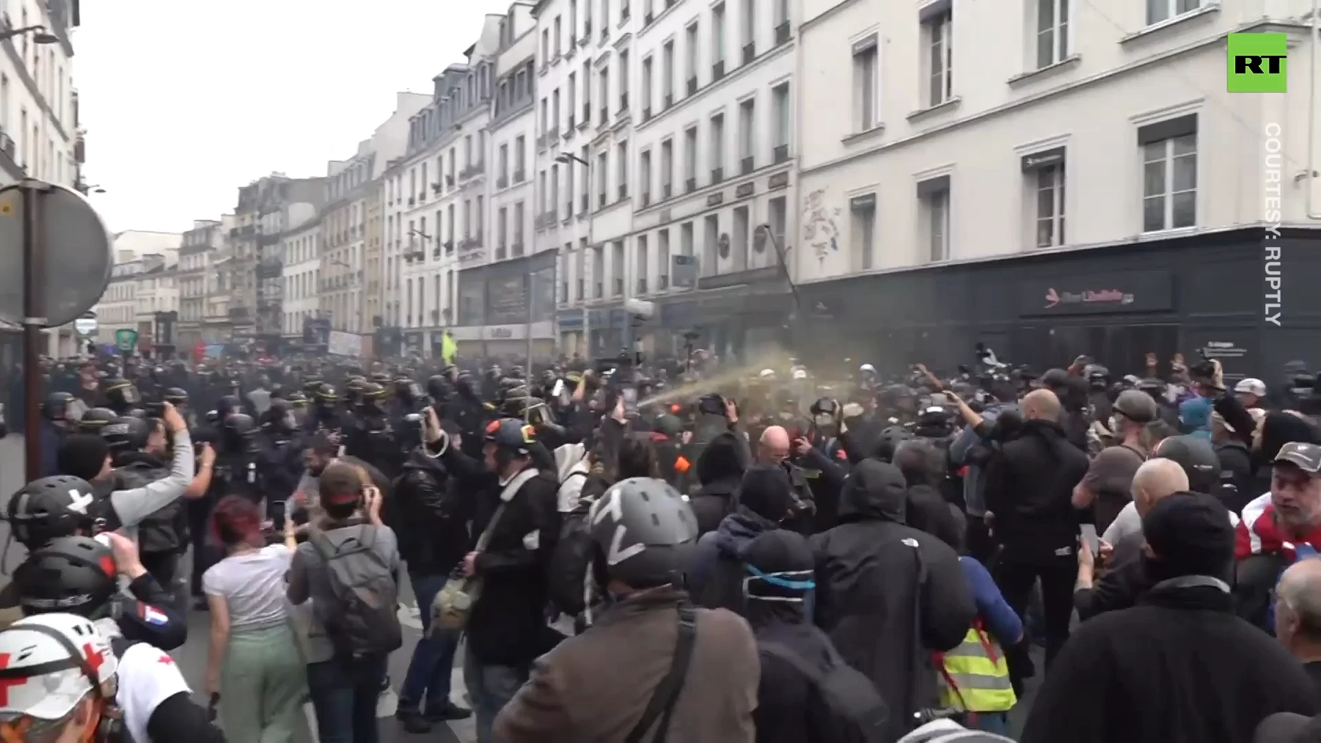 Paris police hits black-clad rioters with tear gas