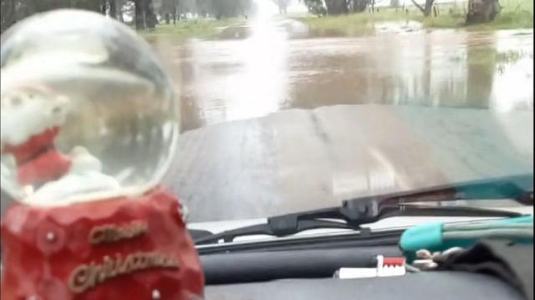 Driving through the shallow flood waters