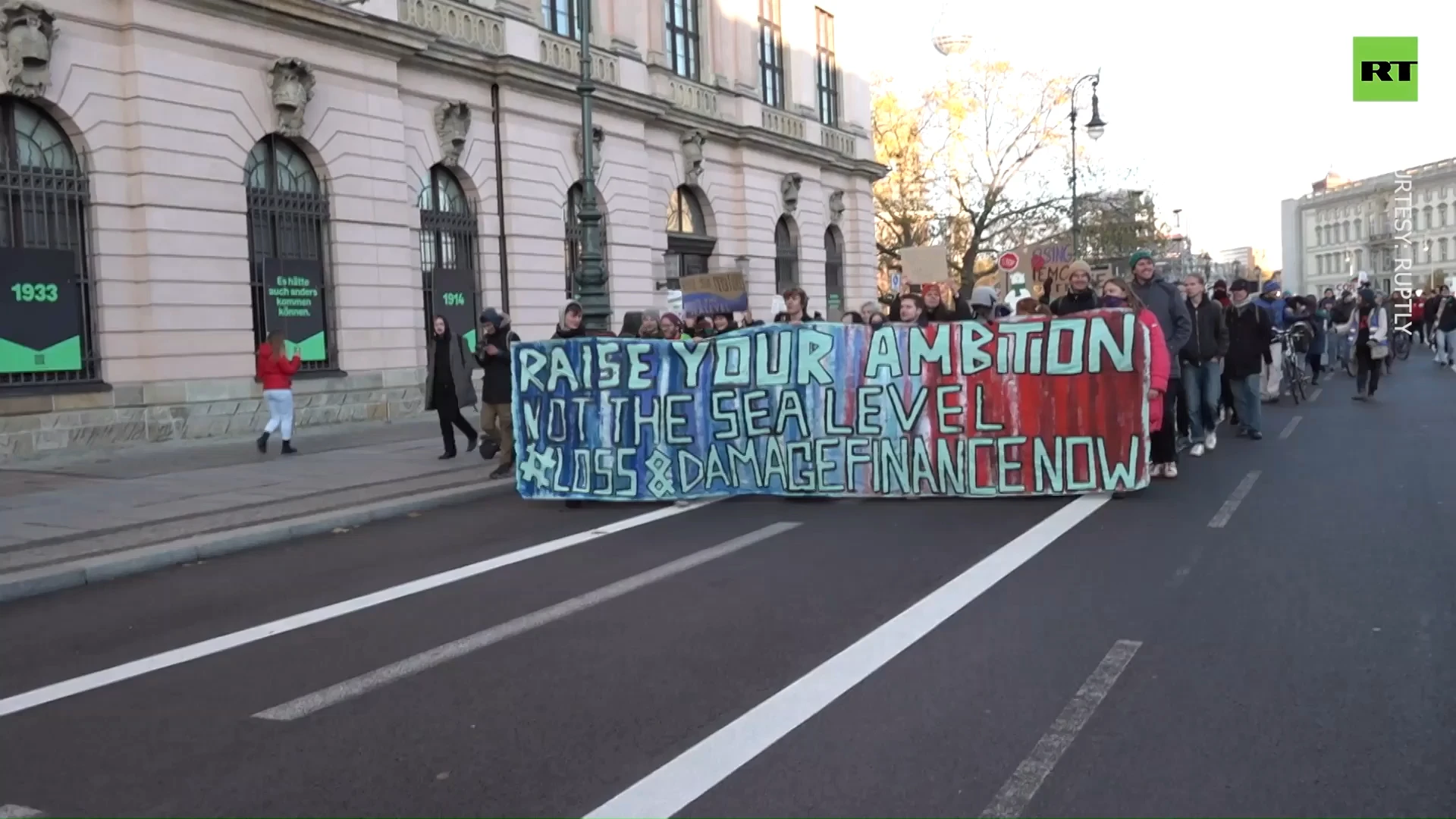 ‘Raise your ambition, not the sea level’: Climate protesters march in Berlin