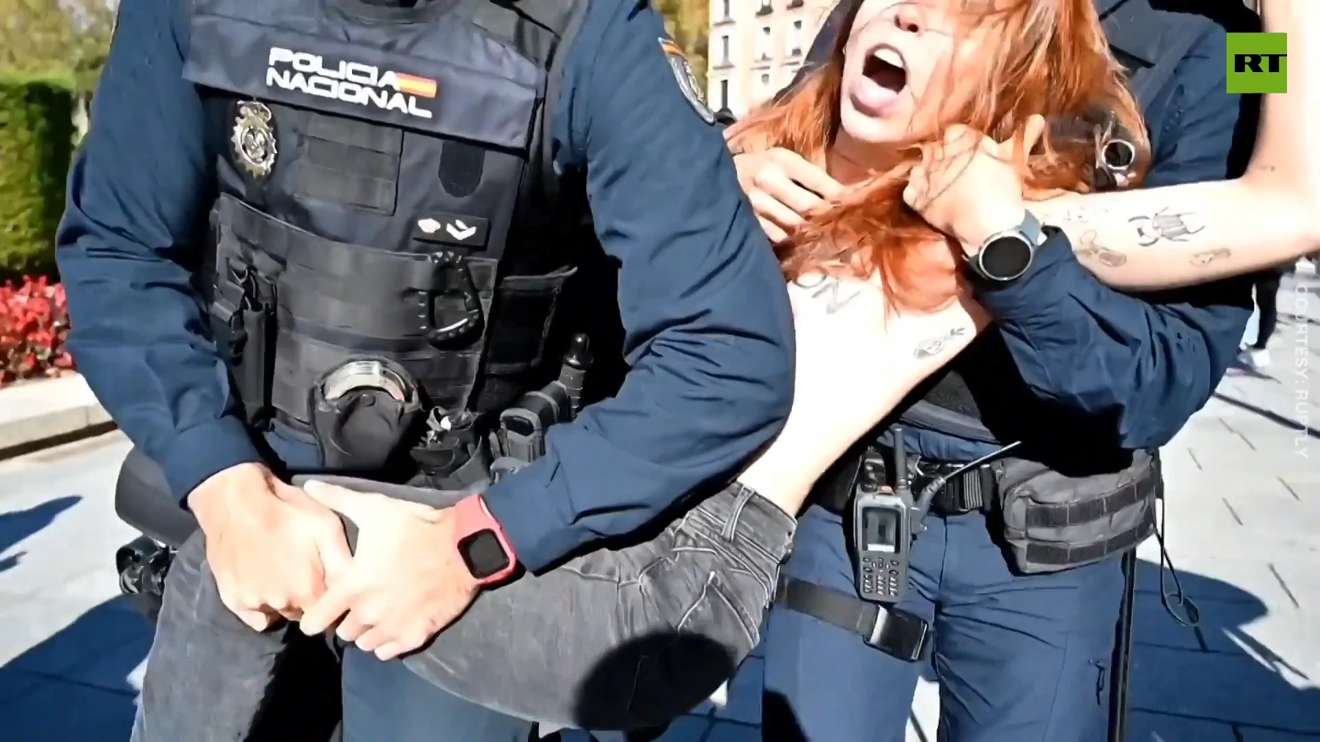 Femen activists detained after attempting to interrupt pro-Franco rally in Madrid