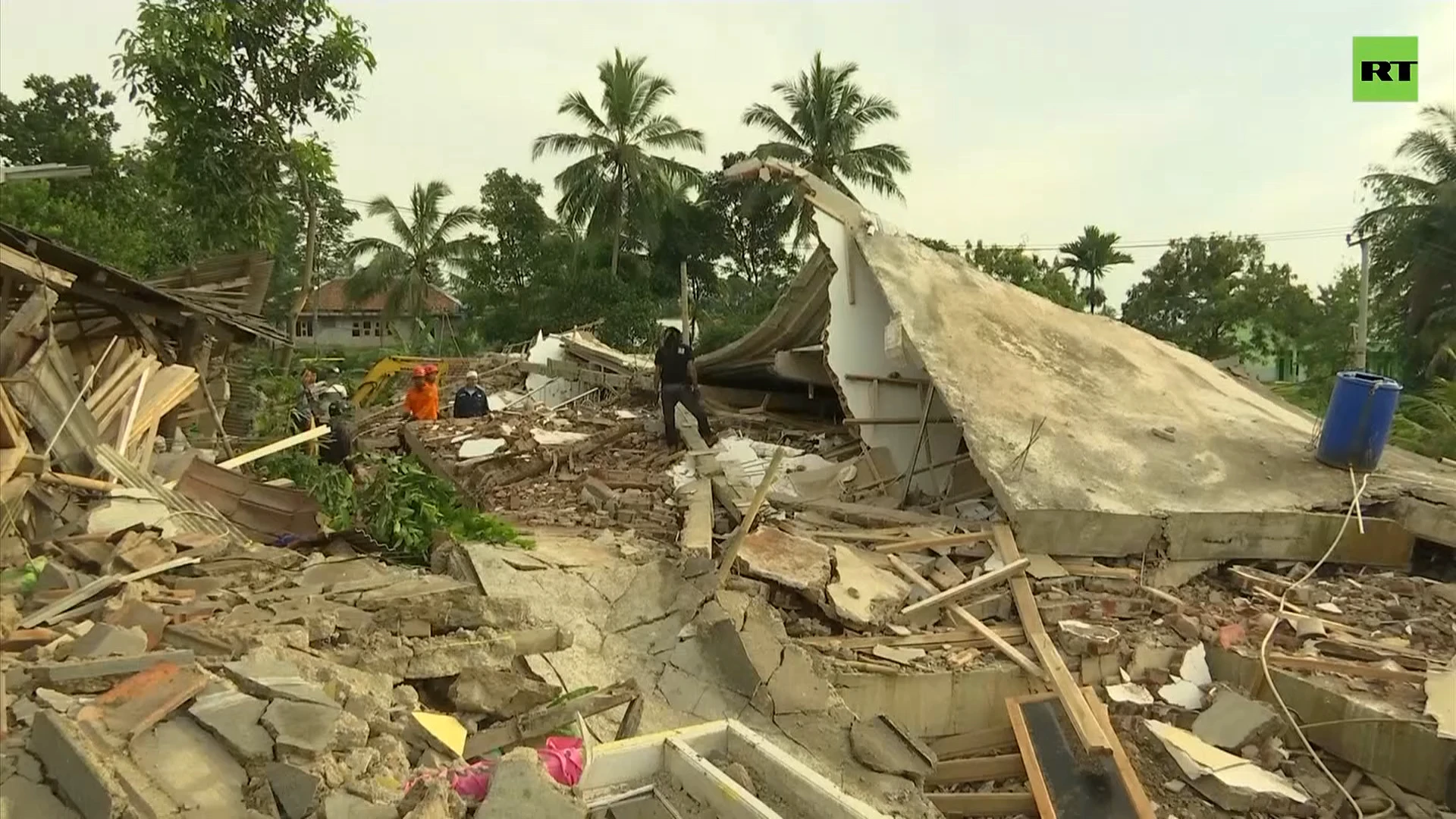 Rescuers search through rubble left by Java earthquake