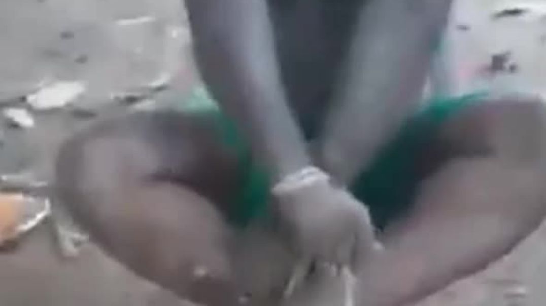 REALLY UGLY DEGENERATE AFRICAN GETS SPANKED THE TRIBAL WAY (TRY NOT TO LAUGH OR YOUR A BAD PERSON