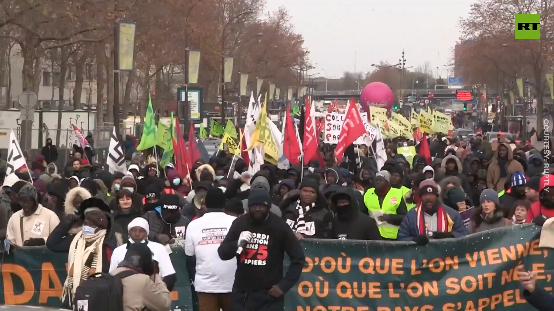 International Migrants Day | Thousands protest against France's immigration bill