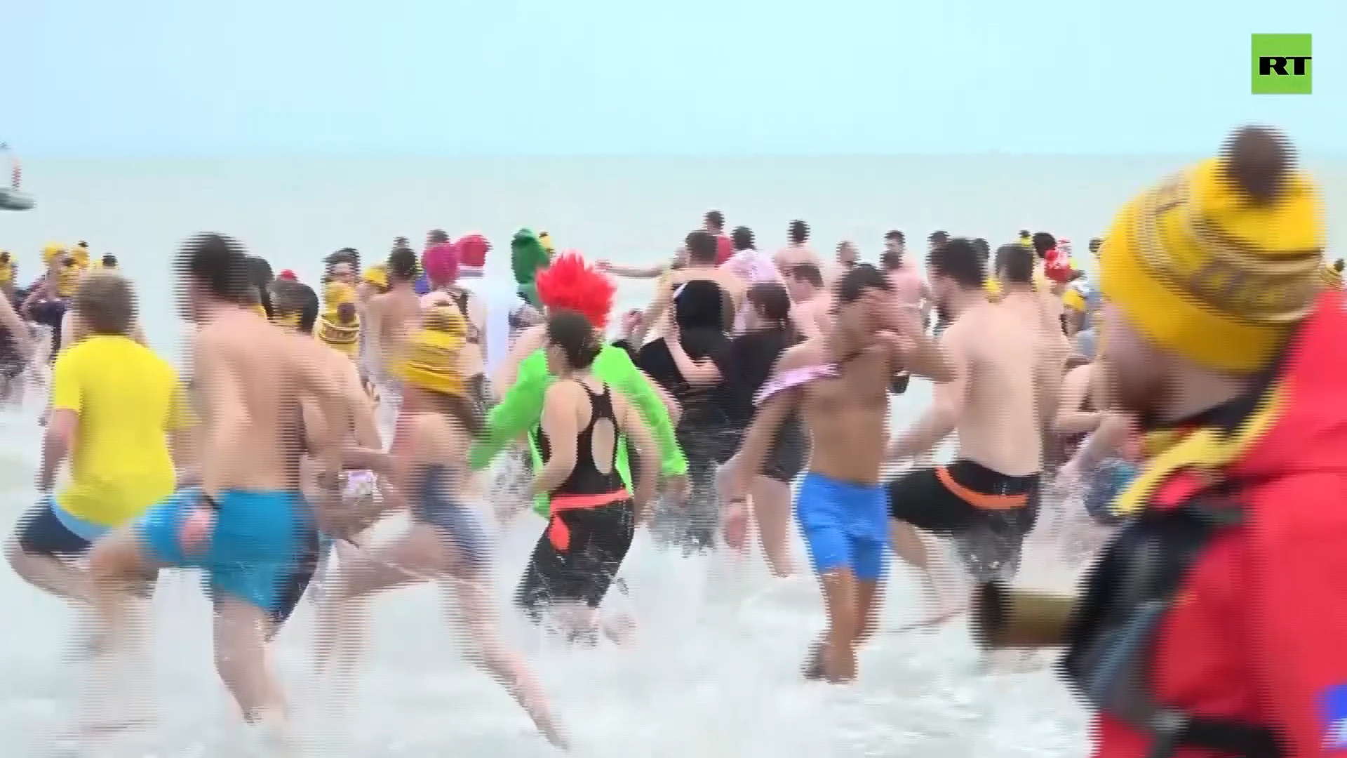 Hardy souls brave chilly waters for New Year’s plunge into North Sea