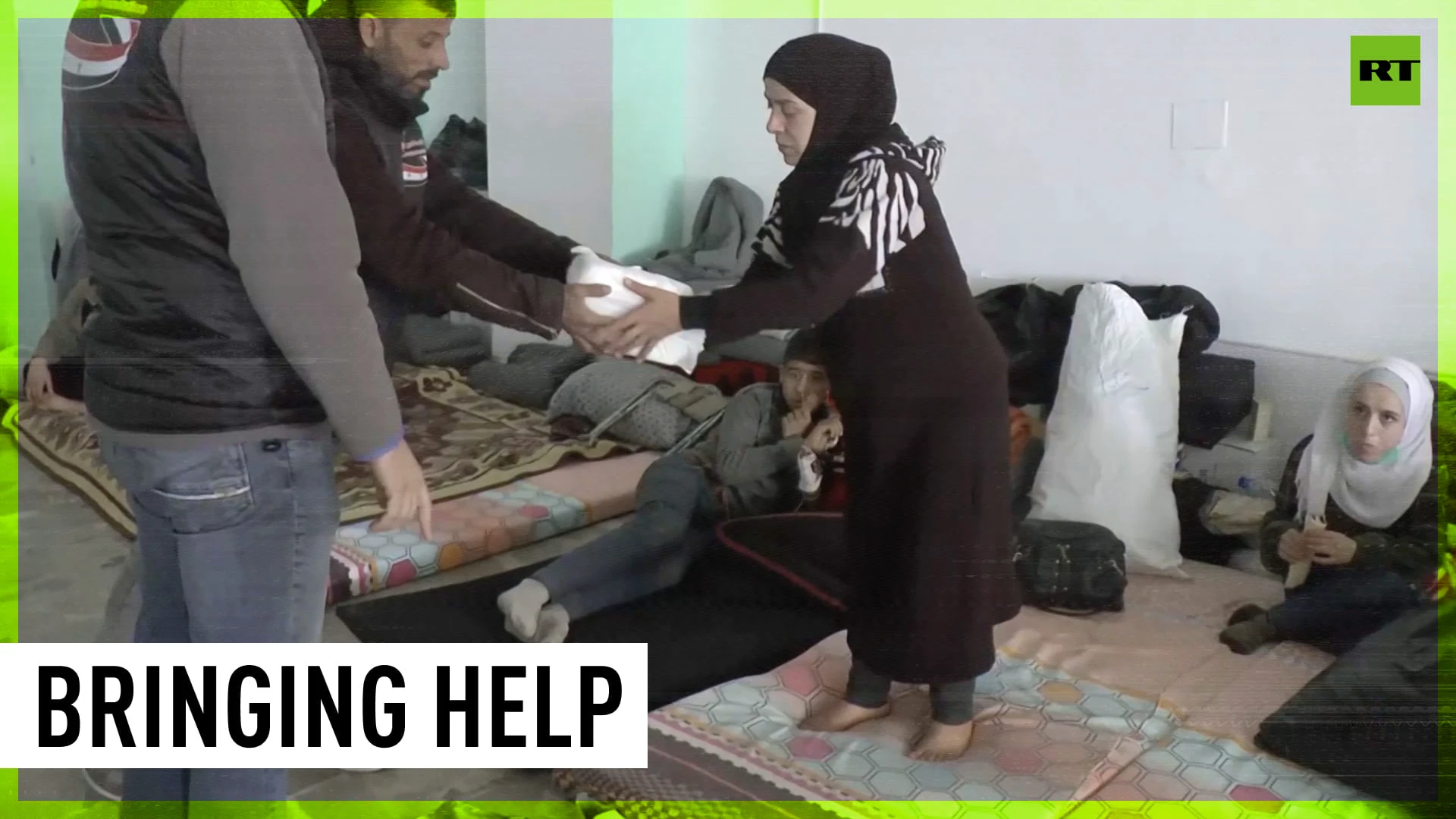 Volunteers prepare meals for earthquake victims at Latakia shelter