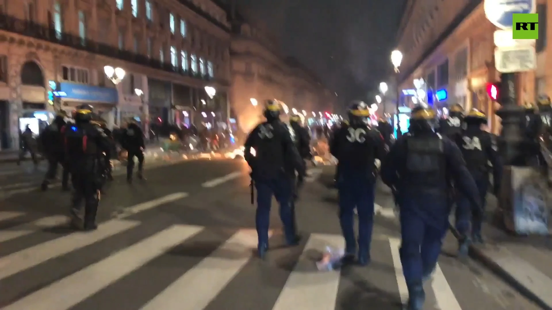 Trash cans set on fire as protest over pension reform grips Paris