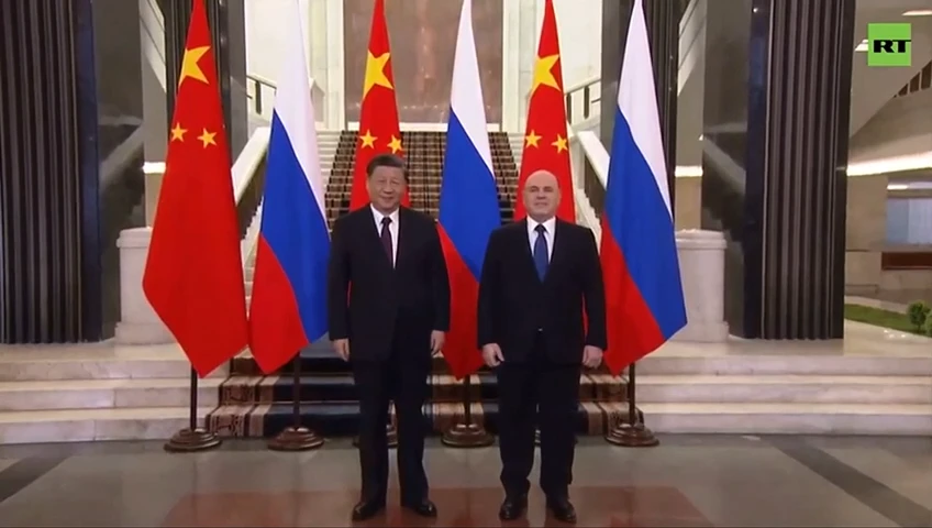 Russian Prime Minister Mishustin greets Chinese President Xi Jinping at Government House in Moscow