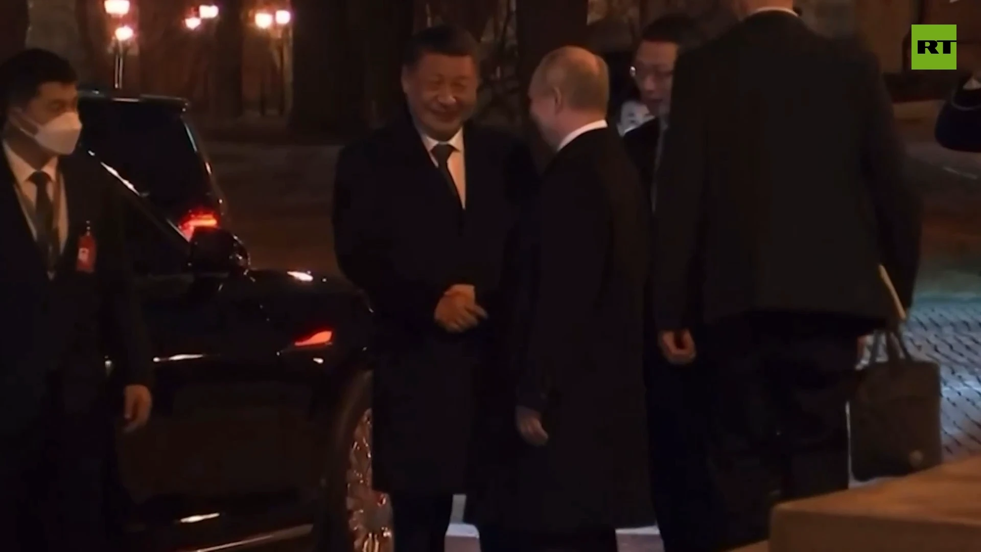 Putin escorts Xi to his car following the talks