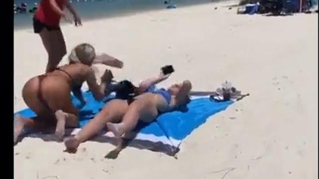 What a way to have fun in the sun, chick fight on the beach