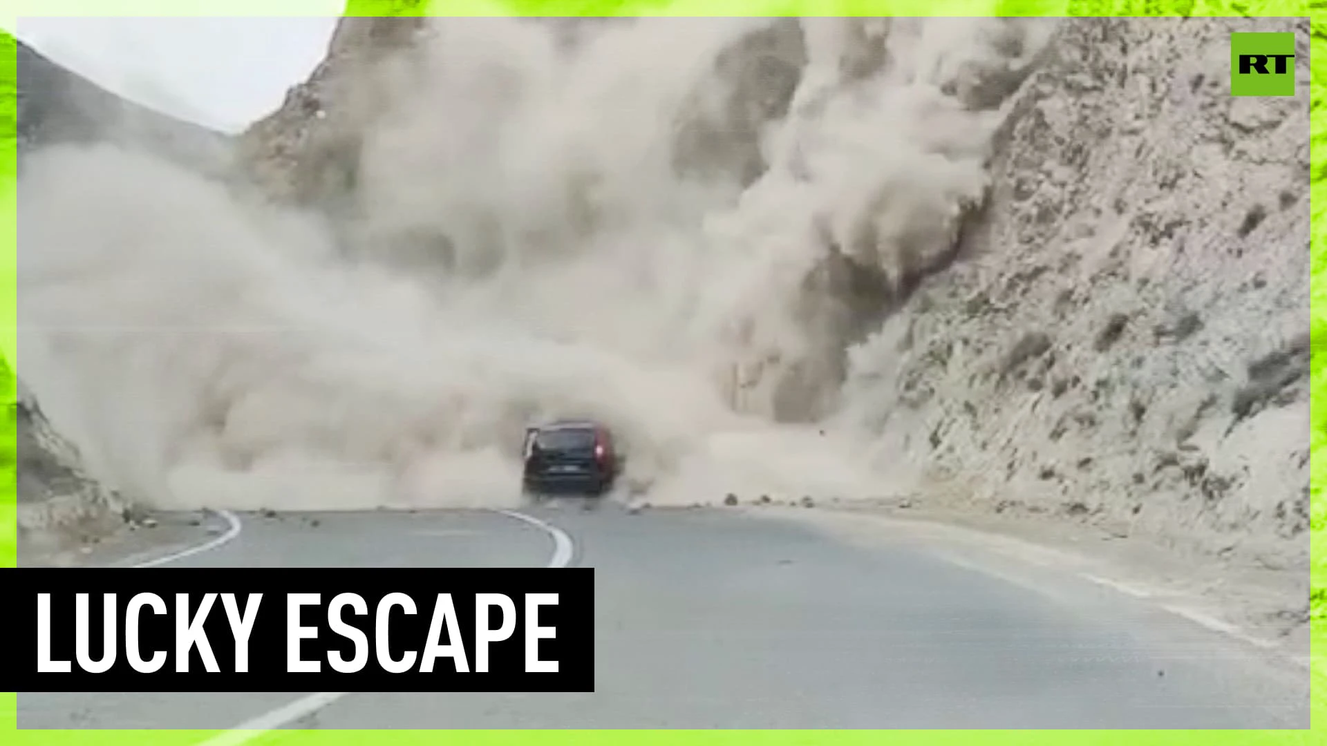 Driver engulfed in rock avalanche, escapes unharmed