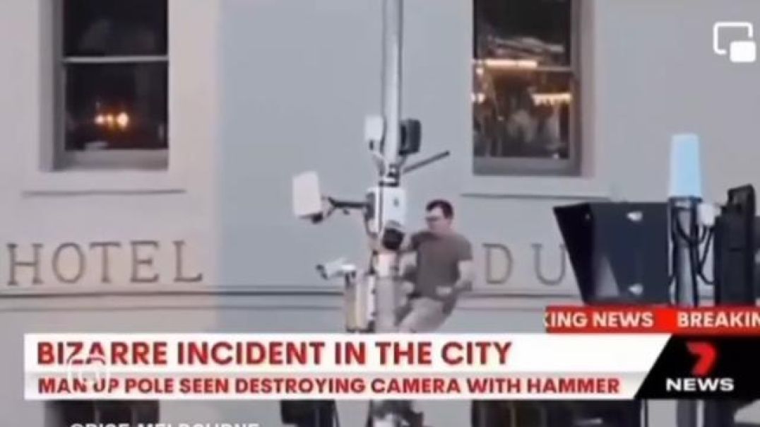 In Communist Melbourne - a man with a hammer knocks down a security CBD camera!!