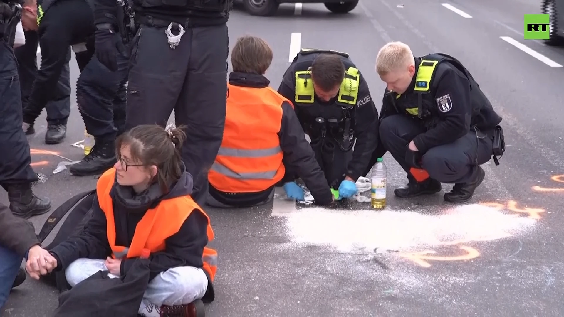 Climate protesters glue themselves to Berlin road