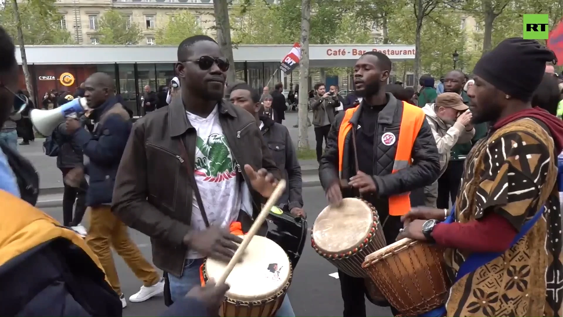 Protesters march (and dance) against controversial immigration bill in Paris