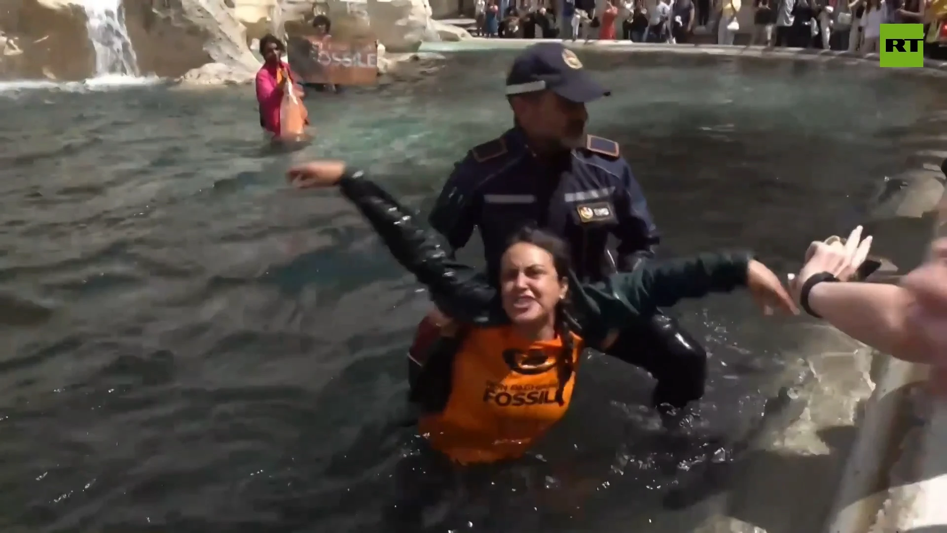 Climate activists turn Rome’s iconic Trevi Fountain black