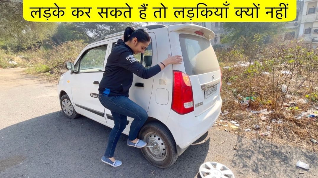 Curry teaches Curryette how to change a flat tyre.  He is good.