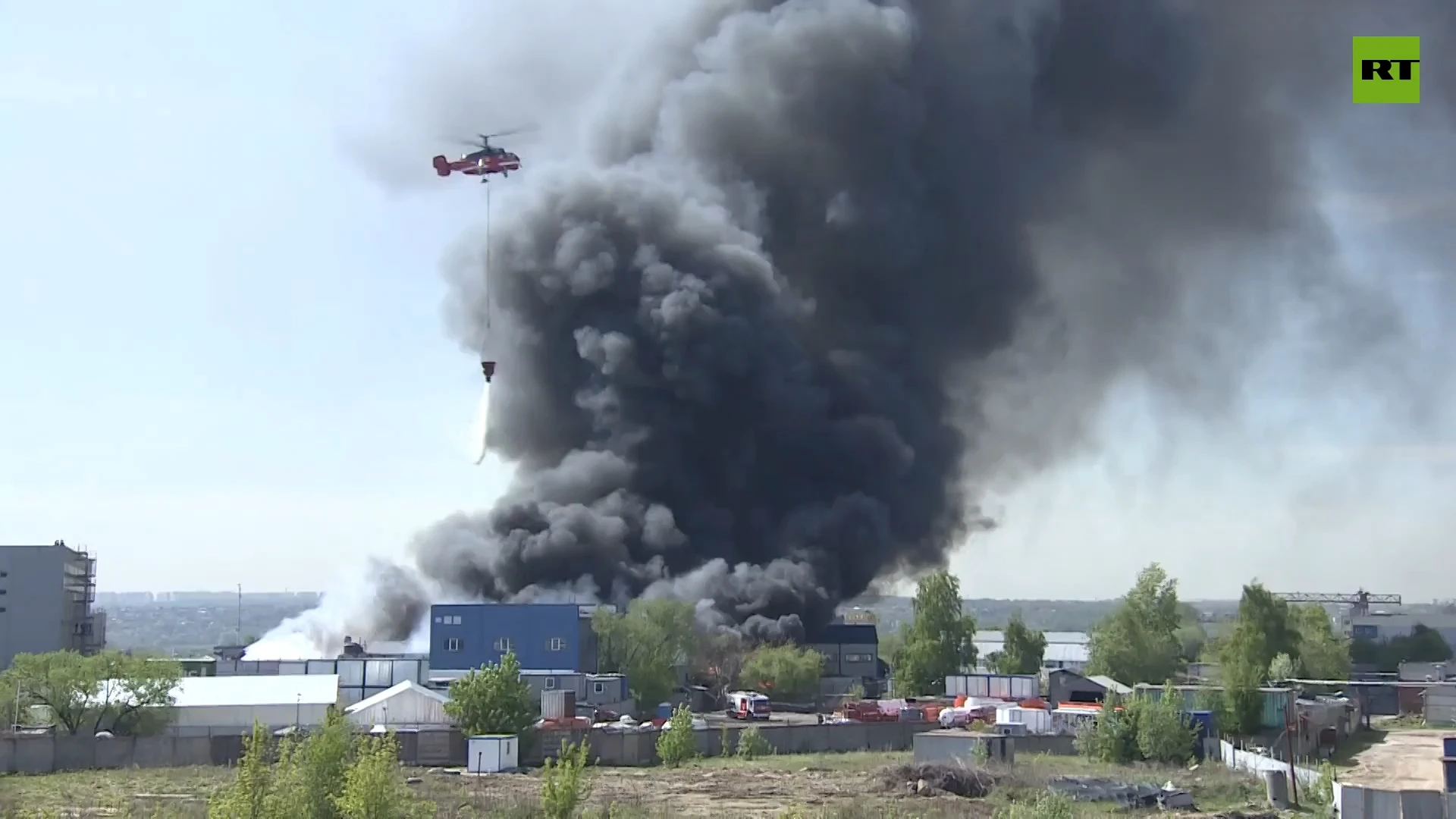 Helicopters battle warehouse fire in Moscow outskirts