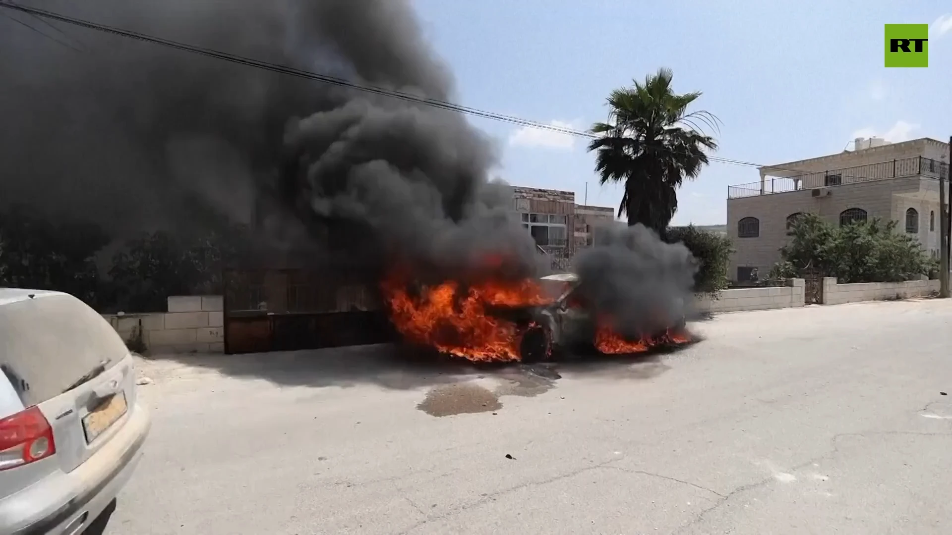 Homes and cars on fire as Israeli settlers descend on Palestinian village in West Bank